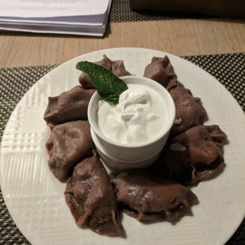 Pierogarnia Mandu - Raspberry-filled chocolate pierogies with sweet cream and an upsold raspberry sauce. Delicious. - Pierogis Near Me - Gdańsk, PM Pierogarnia Mandu - Raspberry-filled chocolate pierogies with sweet cream and an upsold raspberry sauce. Delicious. - Pierogis Near Me - Gdańsk, PM