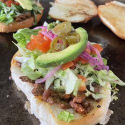 Lupita’s Tacos - Torta de adobada
Bread, mayo spread, adobada meat, lettuce, tomato, red onion, avocado, jalapeños, & spicy or mild salsa