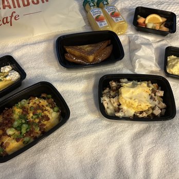 Egg Harbor Café - Modified offerings including grits with bacon and scallions , chicken egg scramble, French toast, and a fruit offering. - Breakfast & Brunch Near Me - Deerfield, Illinois