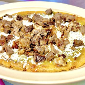Rincon Mexicano - The Huarache suadero, with beans, onions ,spicy green sauce and queso fresco. Delicious!! - Mexican Near Me - Houston, Texas