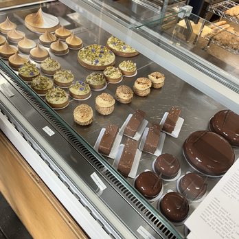 Machine Shop - Chocolate cake (far right), chocolate praline (second from right), hibiscus citrus tart (second from left) - Desserts Near Me - Philadelphia, Pennsylvania Machine Shop - Chocolate cake (far right), chocolate praline (second from right), hibiscus citrus tart (second from left) - Desserts Near Me - Philadelphia, Pennsylvania