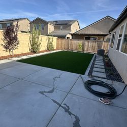 AT Landscaping - Beautiful turf installation with some stepping stones and rocks