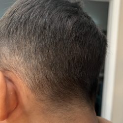 Eastport Barbershop - Extra hair on the back of his head and hair left over, poorly cut around the ears