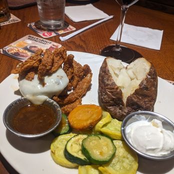 Outback Steakhouse - Bloomin sirloin, side sauce is good.  Specify if you want the potato toppings - Steakhouses Near Me - Peachtree City, Georgia