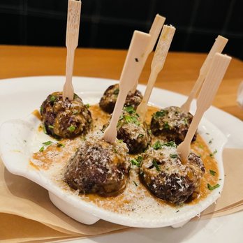 Neighborhood Services - a plate of appetizers with meatballs - New American Near Me - Dallas, Texas Neighborhood Services - a plate of appetizers with meatballs - New American Near Me - Dallas, Texas