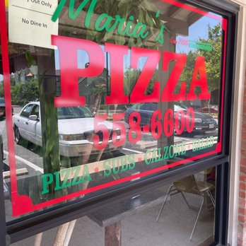 Maria's Pizza - a sign in the window - Pizza Near Me - San Antonio, Texas Maria's Pizza - a sign in the window - Pizza Near Me - San Antonio, Texas