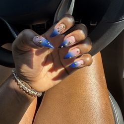 Dolores Beauty Salon - Changed my nail shape of my real nails and was so happy I did it.