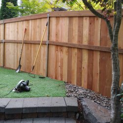 J & A fencing - customer's side. neighbor's side. 6' wood 3 rail, 2x4 top & bottom cap & western red cedar boards.