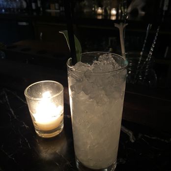 Less Than Greater Than - Pear Brandy, Lemon, Sage, Bitter Bianca served over crushed ice and garnished  with fresh sage - Cocktail Bars Near Me - Hudson, Massachusetts