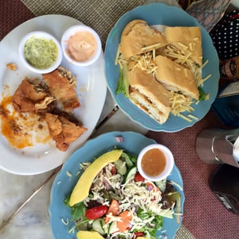 Moreno's Cuba - Half eaten beef and chicken empanadas, el jardin salad, and grilled fish sandwich - Cocktail Bars Near Me - Miami Beach, Florida Moreno's Cuba - Half eaten beef and chicken empanadas, el jardin salad, and grilled fish sandwich - Cocktail Bars Near Me - Miami Beach, Florida