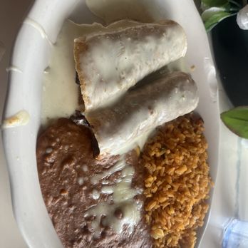 Blue Iguana - Enchiladas sub red sauce for queso with refried beans & rice - Mexican Near Me - Baton Rouge, Louisiana
