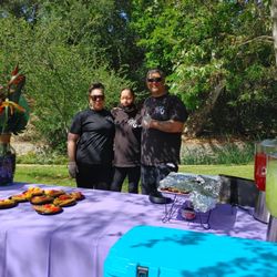 Hawaiian Brian's Catering - Good-looking staff doing their best to smile without melting in the heat.