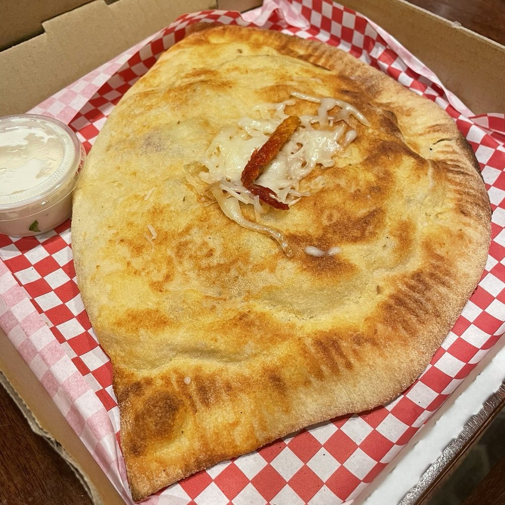 Tomato Street - Chicken Azzurro Calzone - Italian Near Me - Spokane, Washington Tomato Street - Chicken Azzurro Calzone - Italian Near Me - Spokane, Washington