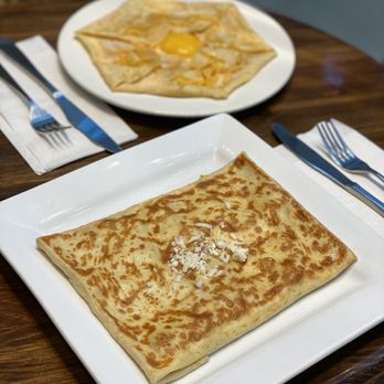 Crêpes De Luxe - two plates of food on a table - Creperies Near Me - Mississauga, Ontario Crêpes De Luxe - two plates of food on a table - Creperies Near Me - Mississauga, Ontario