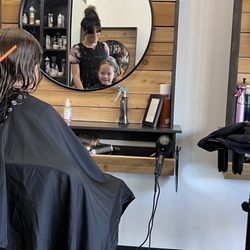 Burman & Co Precision Cuts+Color - Getting a "self-made mullet" corrected with this fab location. Mini looks excited for her first "big girl" cut.