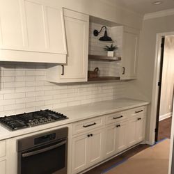 Flooring Express & Full Remodeling LLP - Costume made kitchen cabinets, range hood, wood shelves, and backsplash!
