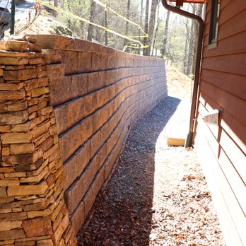 Landscapes Complete - a stone retaining wall in a back yard - Landscaping Near Me - Murphy, North Carolina Landscapes Complete - a stone retaining wall in a back yard - Landscaping Near Me - Murphy, North Carolina