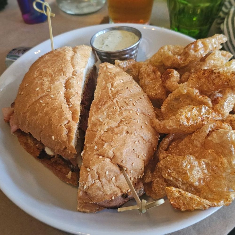 muffaletta sandwich and house made pork rinds