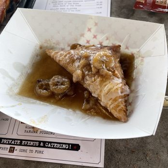 Peg Leg Porker - Fried pie (peach) topped with banana foster glaze - Barbeque Near Me - Nashville, Tennessee Peg Leg Porker - Fried pie (peach) topped with banana foster glaze - Barbeque Near Me - Nashville, Tennessee