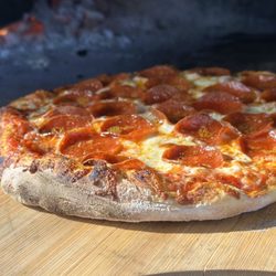 Hand-crafted wood-fired pizza baked at high heat for a signature smoky flavor, served fresh in our casual mountain restaurant.