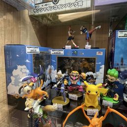 Figures behind glass display Figures behind glass display