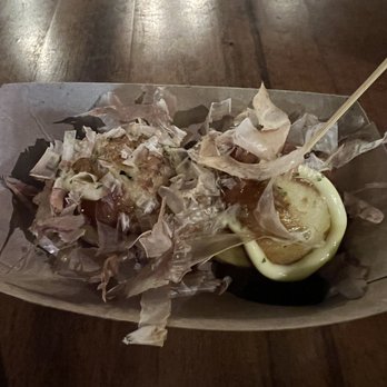 Susuru - Tuesday Special - Takoyaki.  Two ground octopus balls covered in flake and a light sauce for $3.  Half dollar size. - Izakaya Near Me - Orlando, Florida