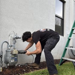 Dom Bella Plumbing - Dom Bella Plumbing technician preparing the main water line for a HALO whole-home water filtration system installation in Port St. Lucie.
