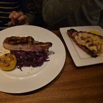 Seasons 52 - Pork chop with cabbage and side lobster tail - New American Near Me - Sarasota, Florida