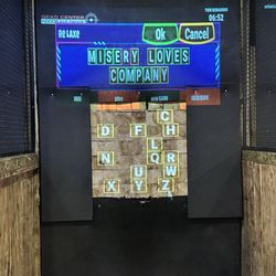 Dead Center Indoor Gun Range - Axe throwing word game