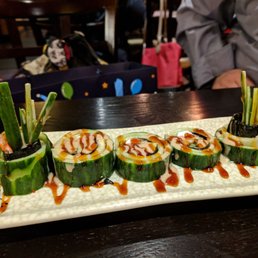 a plate of sushi on a table a plate of sushi on a table