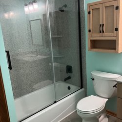 Schafer Brothers Remodeling - New cast-iron tub, shower doors, surround, toilet, flooring, bath cabinet