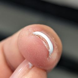 Trifecta Beauty - Nail edges were not capped.