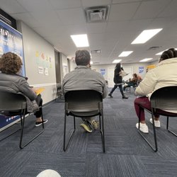 Driver Licensing Regional Office - View from me the waiting area in the age of COVID. Signs are posted that masks are required, but unfortunately, they aren't enforcing it.