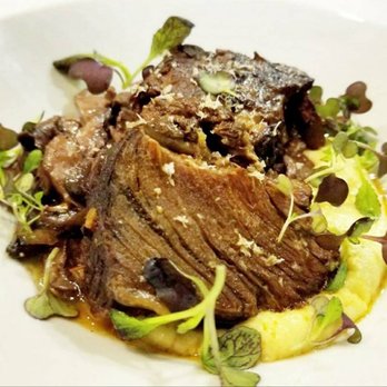At The Table - Braised short rib with truffle polenta and wild mushrooms - New American Near Me - Wayne, Pennsylvania At The Table - Braised short rib with truffle polenta and wild mushrooms - New American Near Me - Wayne, Pennsylvania