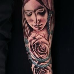 Rose tattoo with the Virgin Mary