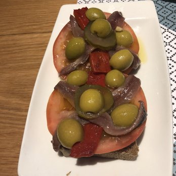 Vinitus - This was the one we ordered out on a whim without knowing what it was. Anchovies with olives, tomato, red pepper on bread. - Tapas Bars Near Me - Barcelona, B Vinitus - This was the one we ordered out on a whim without knowing what it was. Anchovies with olives, tomato, red pepper on bread. - Tapas Bars Near Me - Barcelona, B