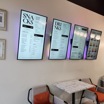 Bobaholics - a wall of menus and chairs - Bubble Tea Near Me - San Jose, California