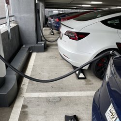 Tesla Supercharger - Full house. Several people who just used the spots for parking while others wait to charge. Rude.