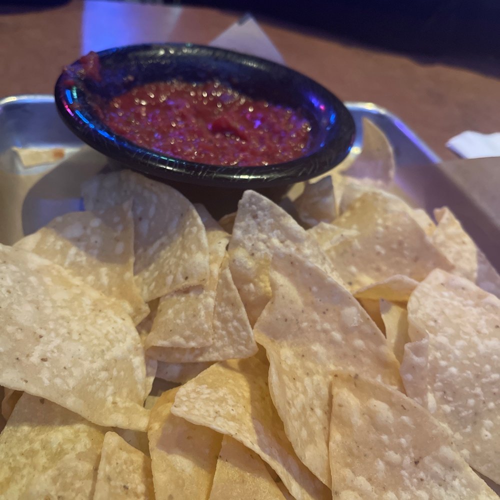 a bowl of salsa and tortilla chips a bowl of salsa and tortilla chips