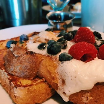 Hook & Plow - French toast topped with whipped cream and seasonal fruits - New American Near Me - Seattle, Washington