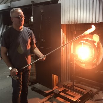 GlassRoots - Phil at the glory hole where he melts the colors into the paperweight. - Community Service/Non-Profit Near Me - Newark, New Jersey GlassRoots - Phil at the glory hole where he melts the colors into the paperweight. - Community Service/Non-Profit Near Me - Newark, New Jersey
