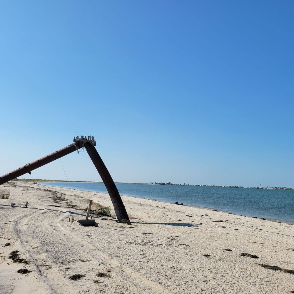 The Brigadune Inn - Old mast at the end of the beach. During low tide you can walk pretty far out into the bay on the sand bar. - Bed & Breakfast Near Me - Tangier, Virginia The Brigadune Inn - Old mast at the end of the beach. During low tide you can walk pretty far out into the bay on the sand bar. - Bed & Breakfast Near Me - Tangier, Virginia