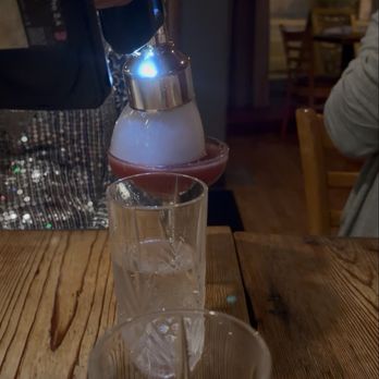 Libertad - Fancy cocktail that came with a frozen blow torch presentation lol - Latin American Near Me - Skokie, Illinois