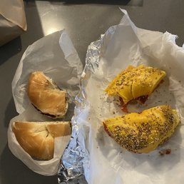 Salted bagel with olive cream cheese and a Taylor ham, egg and cheese on an egg everything bagel