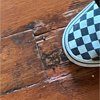 At Home Properties - Nails protruding from loose floorboard. Good thing I had shoes - Property Management Near Me - Philomath, Oregon