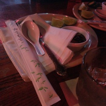 Legends Grill - a place setting with a spoon, napkin, and spoon rest - Sports Bars Near Me - Stafford, Texas