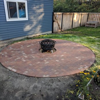 Rigoberto's Landscaping & Brick Paving - Round firepit, using existing bricks. We had asked him to leave the left-side dirt as-is, for future gardening - Landscaping Near Me Rigoberto's Landscaping & Brick Paving - Round firepit, using existing bricks. We had asked him to leave the left-side dirt as-is, for future gardening - Landscaping Near Me