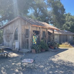 a picnic table and a barn a picnic table and a barn