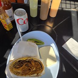 Chilaquiles burrito with steak and eggs