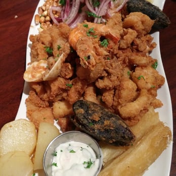 El Chullo Peruvian Restaurant & Bar - Ceviche mixto- this had fried seafood and then some potatoes and choclo, which is big corn kernels and some onions- SO GOOD - Peruvian Near Me - Phoenix, Arizona El Chullo Peruvian Restaurant & Bar - Ceviche mixto- this had fried seafood and then some potatoes and choclo, which is big corn kernels and some onions- SO GOOD - Peruvian Near Me - Phoenix, Arizona